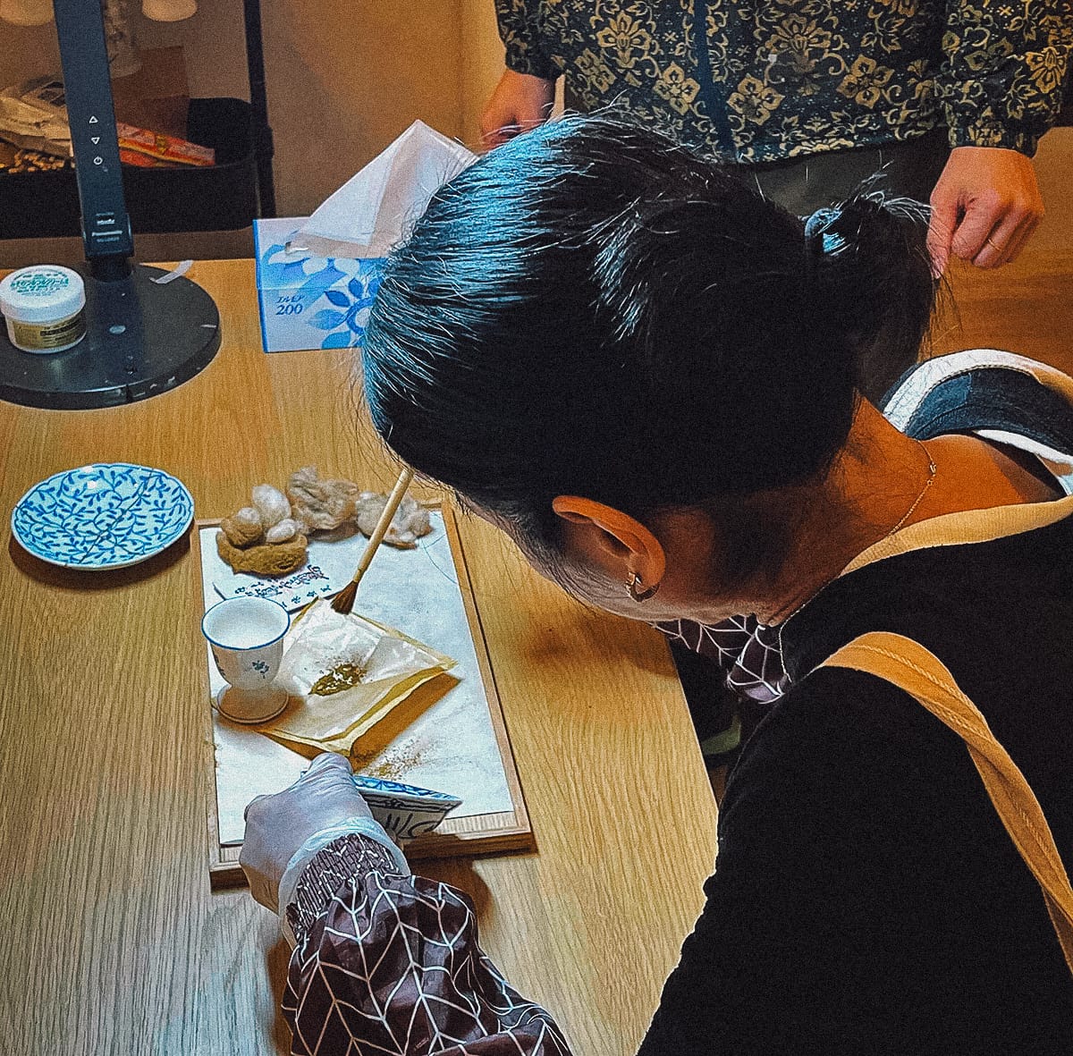Kintsugi in Kyoto Brushing gold powder over the urushi lacquer
