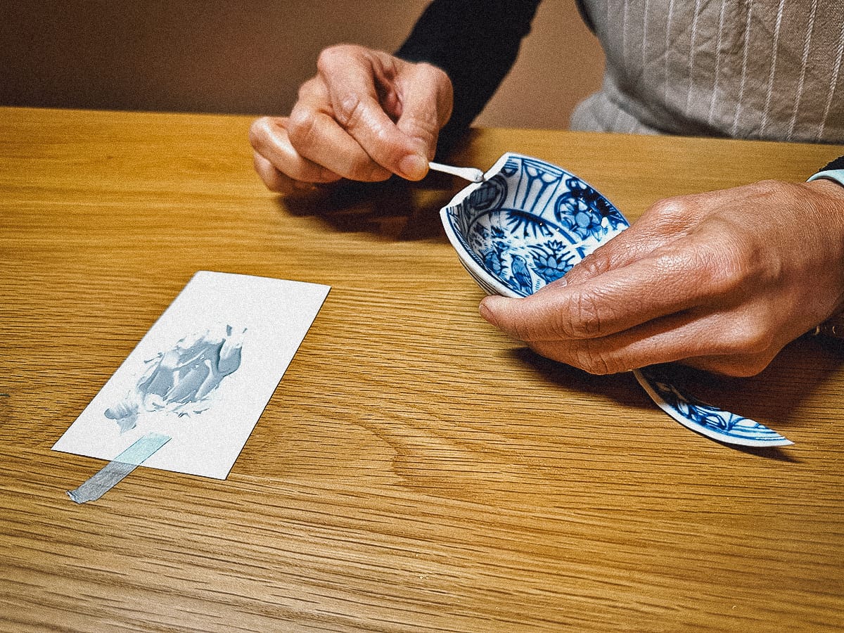 Kintsugi in Kyoto Applying epoxy resin to the broken piece of pottery