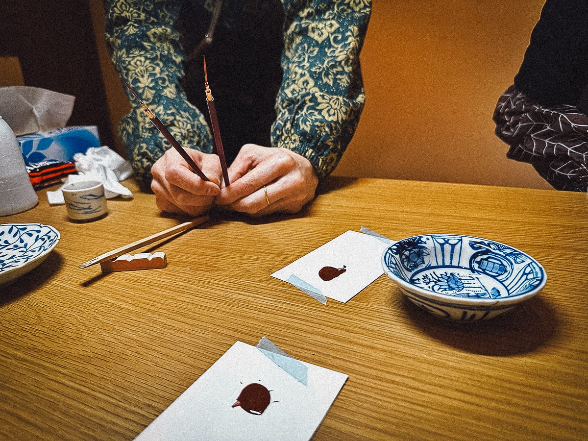 Kintsugi in Kyoto Teacher showing urushi lacquer brushes