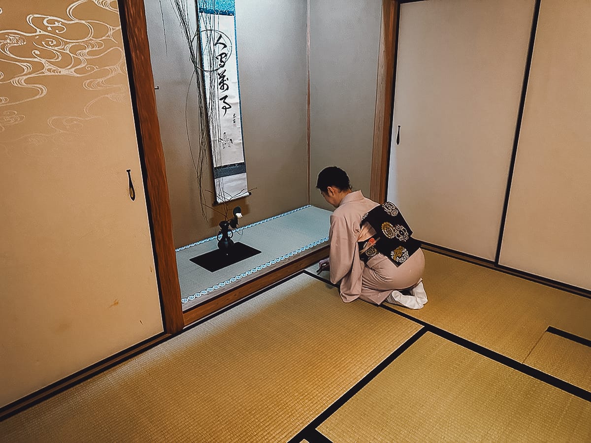 The Japanese Tea Ceremony Japanese woman bowing before an alcove